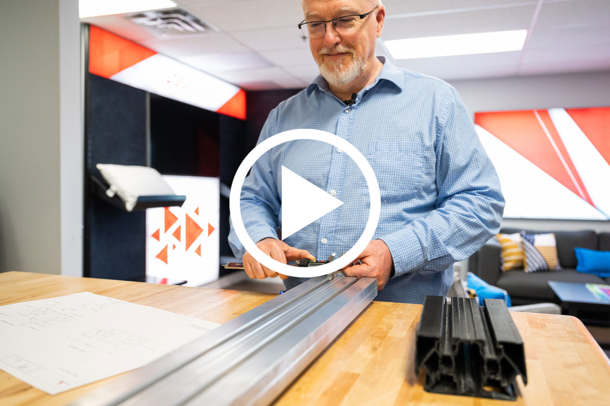 Video thumbnail of a man using a digital caliper to measure a metal extrusion on a table.