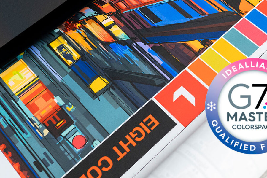 A vibrant, abstract print featuring color swatches displayed alongside the Idealliance G7 Master Colorspace Qualified Facility logo.