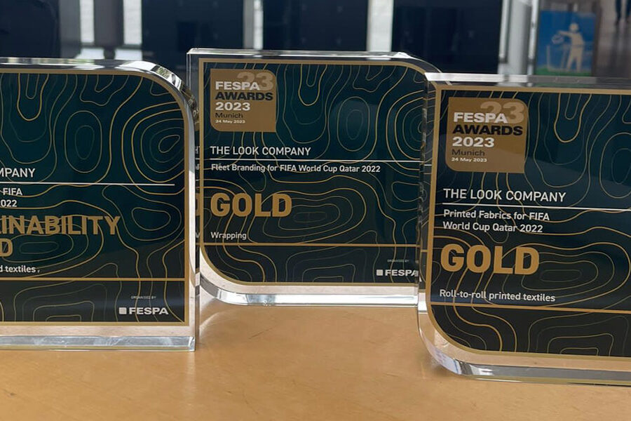 Three FESPA Awards 2023 trophies for The Look Company, including a Sustainability Award and two Gold Awards.