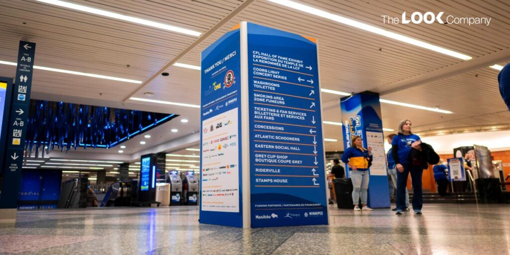 Grey Cup 2025 Wayfinding view - SEG Fabric vs. Rigid Signage